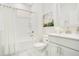 Well-lit bathroom with a shower-tub combo and vanity with white cabinets at 121 Sacred Fire Rd, Louisburg, NC 27549