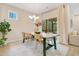 Inviting dining area with a wooden table, soft lighting, and easy access to the outdoor living space at 121 Sacred Fire Rd, Louisburg, NC 27549