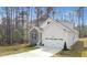 Charming two-story home with stone accents, a two-car garage, and a well-manicured lawn in a desirable community at 121 Sacred Fire Rd, Louisburg, NC 27549