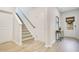 Welcoming foyer with hardwood floors, a staircase, and a view of the outdoors at 121 Sacred Fire Rd, Louisburg, NC 27549