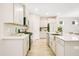 Well-lit kitchen with ample cabinet space, stainless steel appliances, and a stylish island sink at 121 Sacred Fire Rd, Louisburg, NC 27549