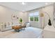 Comfortable living room with neutral tones, a plush sofa, and large windows offering natural light at 121 Sacred Fire Rd, Louisburg, NC 27549
