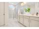 Modern main bathroom with a double sink vanity, a glass enclosed shower, and pristine finishes at 121 Sacred Fire Rd, Louisburg, NC 27549