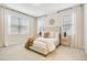 Serene main bedroom with soft carpet, neutral walls, and large windows offering plenty of natural light at 121 Sacred Fire Rd, Louisburg, NC 27549