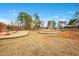 A wide shot of playground featuring a swing set, rocket, picnic table, and a covered structure at 121 Sacred Fire Rd, Louisburg, NC 27549