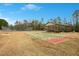 Shuffleboard and picnic shelter offering recreational opportunities for residents in a park-like setting at 121 Sacred Fire Rd, Louisburg, NC 27549