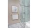 Well-appointed bathroom with marble shower, glass enclosure, and neutral wall color, combining style and comfort at 122 N Harrington St # 1105, Raleigh, NC 27603