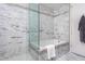Elegant bathroom featuring marble walls, a tub, and a frameless glass shower at 122 N Harrington St # 1105, Raleigh, NC 27603