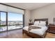 Comfortable bedroom featuring large windows, hardwood floors, and refined furnishings at 122 N Harrington St # 1105, Raleigh, NC 27603