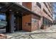 Exterior view of the building entrance, featuring a brick facade and modern architectural elements at 122 N Harrington St # 1105, Raleigh, NC 27603