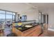 Modern kitchen featuring stainless steel appliances, light wood cabinets, and an open layout to the living area at 122 N Harrington St # 1105, Raleigh, NC 27603