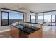 Modern kitchen with stone countertops, stainless appliances, and a bright open floorplan at 122 N Harrington St # 1105, Raleigh, NC 27603