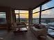 Inviting living room with expansive windows, offering sunset and city views at 122 N Harrington St # 1105, Raleigh, NC 27603