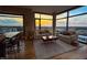 Living room boasting large windows, plush sofas, and captivating sunset views over the city skyline at 122 N Harrington St # 1105, Raleigh, NC 27603
