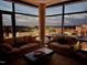 Elegant living room with floor-to-ceiling windows offering panoramic city views and cozy seating arrangements at 122 N Harrington St # 1105, Raleigh, NC 27603