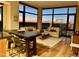 Bright living room with floor-to-ceiling windows offers stunning city views and hardwood flooring at 122 N Harrington St # 1105, Raleigh, NC 27603