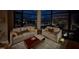 Comfortable living space with views of the city skyline at night, creating a relaxing atmosphere at 122 N Harrington St # 1105, Raleigh, NC 27603