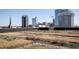 Rooftop garden with gravel beds and decorative grasses, set against a stunning cityscape backdrop on a clear day at 122 N Harrington St # 1105, Raleigh, NC 27603