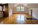 Spacious bonus room with hardwood floors, window seat, and unique wood accents at 1269 Manns Chapel Rd, Pittsboro, NC 27312