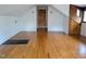 Open attic bonus room with hardwood floors, dormer windows, and unique wood accents at 1269 Manns Chapel Rd, Pittsboro, NC 27312