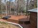 Large wooden deck with hot tub overlooking a lake at 1269 Manns Chapel Rd, Pittsboro, NC 27312