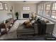 Inviting living room featuring a fireplace, comfortable seating, and natural light from large windows at 1269 Manns Chapel Rd, Pittsboro, NC 27312