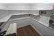 Storage area featuring multiple shelves with white paint, and vinyl flooring at 1269 Manns Chapel Rd, Pittsboro, NC 27312