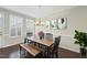 Dining room featuring modern chandelier, and hardwood floors at 1319 Rodessa Run, Raleigh, NC 27607