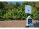 Outside dog park area with black metal fence and waste station with bag dispenser near the sign at 1319 Rodessa Run, Raleigh, NC 27607