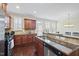 Open kitchen featuring granite countertops and stainless steel appliances at 1319 Rodessa Run, Raleigh, NC 27607