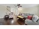 Spacious living room with hardwood floors, fireplace, and comfortable seating at 1319 Rodessa Run, Raleigh, NC 27607