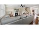 Open-concept living room with fireplace, hardwood floors, and natural light at 1319 Rodessa Run, Raleigh, NC 27607