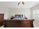 Main bedroom featuring tray ceiling, ceiling fan, and neutral color palette at 1319 Rodessa Run, Raleigh, NC 27607