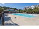 Community pool with lots of seating, mature trees, and multiple buildings at 1319 Rodessa Run, Raleigh, NC 27607