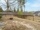 Large backyard with a fire pit, perfect for outdoor gatherings and enjoying the natural surroundings at 177 Magenta Rose Dr, Raleigh, NC 27610