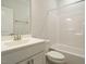 Clean bathroom with a white vanity, toilet, and a shower/tub combo, creating a functional space at 177 Magenta Rose Dr, Raleigh, NC 27610