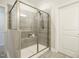 Bathroom with a walk-in shower with a bench at 177 Magenta Rose Dr, Raleigh, NC 27610