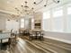 Bright dining area featuring stylish lighting, neutral tones, and ample seating for a comfortable dining experience at 177 Magenta Rose Dr, Raleigh, NC 27610
