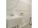 Functional laundry room area with a utility sink and essential plumbing fixtures, designed for convenience at 177 Magenta Rose Dr, Raleigh, NC 27610