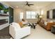 Spacious living room with contemporary furnishings, lots of natural light, modern décor, and a ceiling fan at 177 Magenta Rose Dr, Raleigh, NC 27610