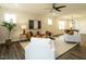 Open-concept living room blending comfort and style, featuring hardwood floors and modern furniture at 177 Magenta Rose Dr, Raleigh, NC 27610