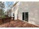 A wood deck with direct access to the home's interior through a sliding glass door at 202 River Hills Dr, Clayton, NC 27527