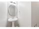 Bathroom featuring a pedestal sink, modern fixtures, and neutral paint at 202 River Hills Dr, Clayton, NC 27527