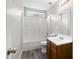 Bathroom featuring a tub-shower combo, a wooden vanity with sink, and wood-look floors at 202 River Hills Dr, Clayton, NC 27527