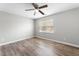 Bedroom with updated wood flooring and a window providing natural light at 202 River Hills Dr, Clayton, NC 27527