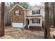 Charming two-story home with a stone facade and inviting front porch at 202 River Hills Dr, Clayton, NC 27527