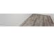 Close up of light gray toned laminate plank flooring at 202 River Hills Dr, Clayton, NC 27527