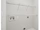 Laundry room with hookups and wire shelving at 202 River Hills Dr, Clayton, NC 27527