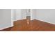 Hardwood floors, neutral paint, and bright natural light in this living room at 202 River Hills Dr, Clayton, NC 27527