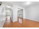 Spacious living area with hardwood floors and large windows at 202 River Hills Dr, Clayton, NC 27527